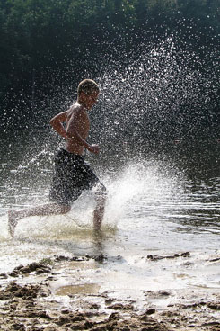 Boy Splashes in Water